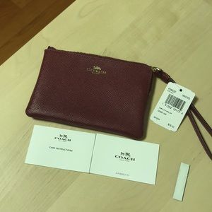 Authentic Coach wristlet in Crimson color